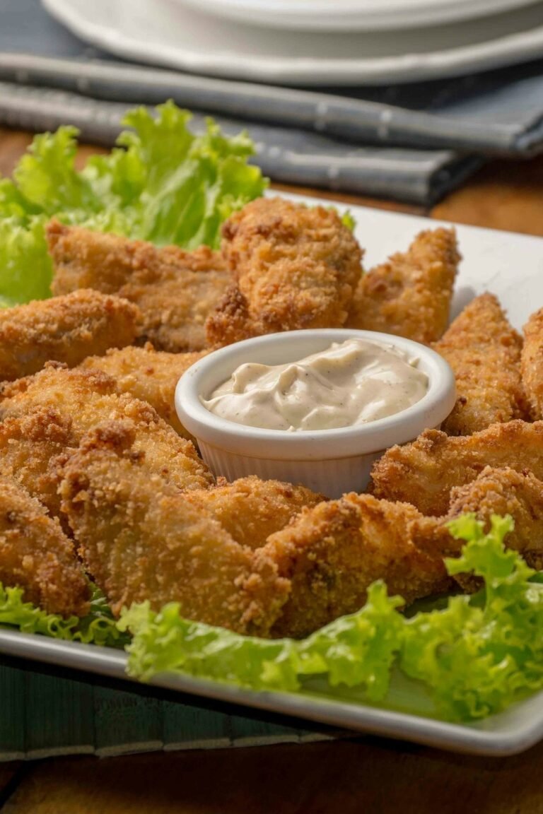 Crispy air fryer hot honey chicken bites served with creamy dipping sauce