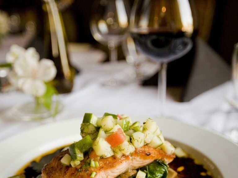 Air fryer honey garlic salmon fillet with sticky glaze, sesame seeds, and spring onions