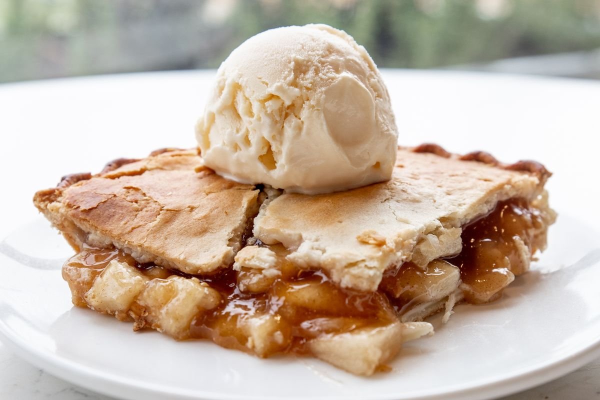 Apple pie slice with vanilla ice cream