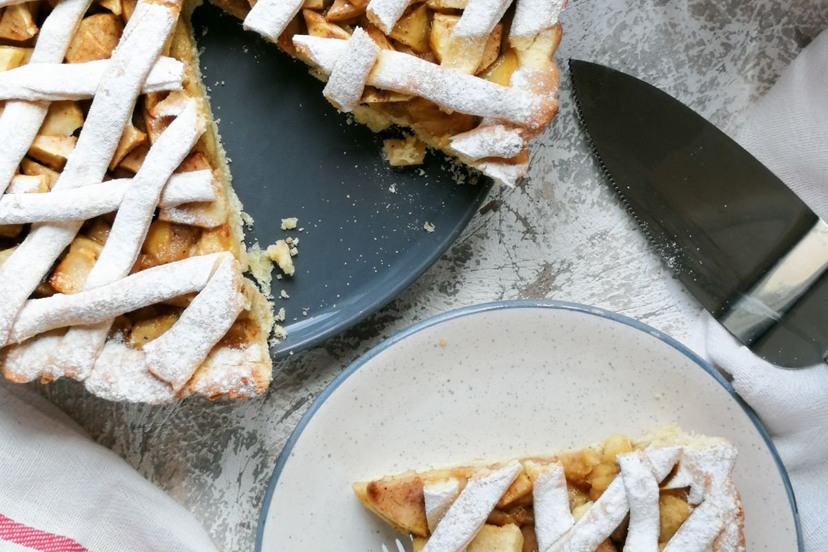 Lattice apple pie with slice cut