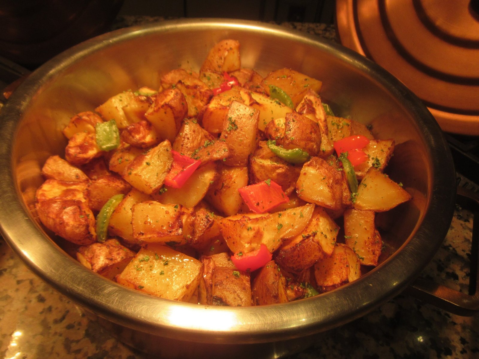 Roasted potatoes with peppers in a pan