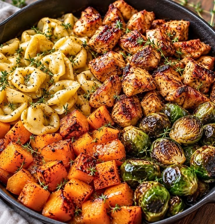 Chicken Tortellini with Roasted Veggies 2 Chicken tortellini with roasted veggies in a skillet — chicken bites, butternut squash and Brussels sprouts