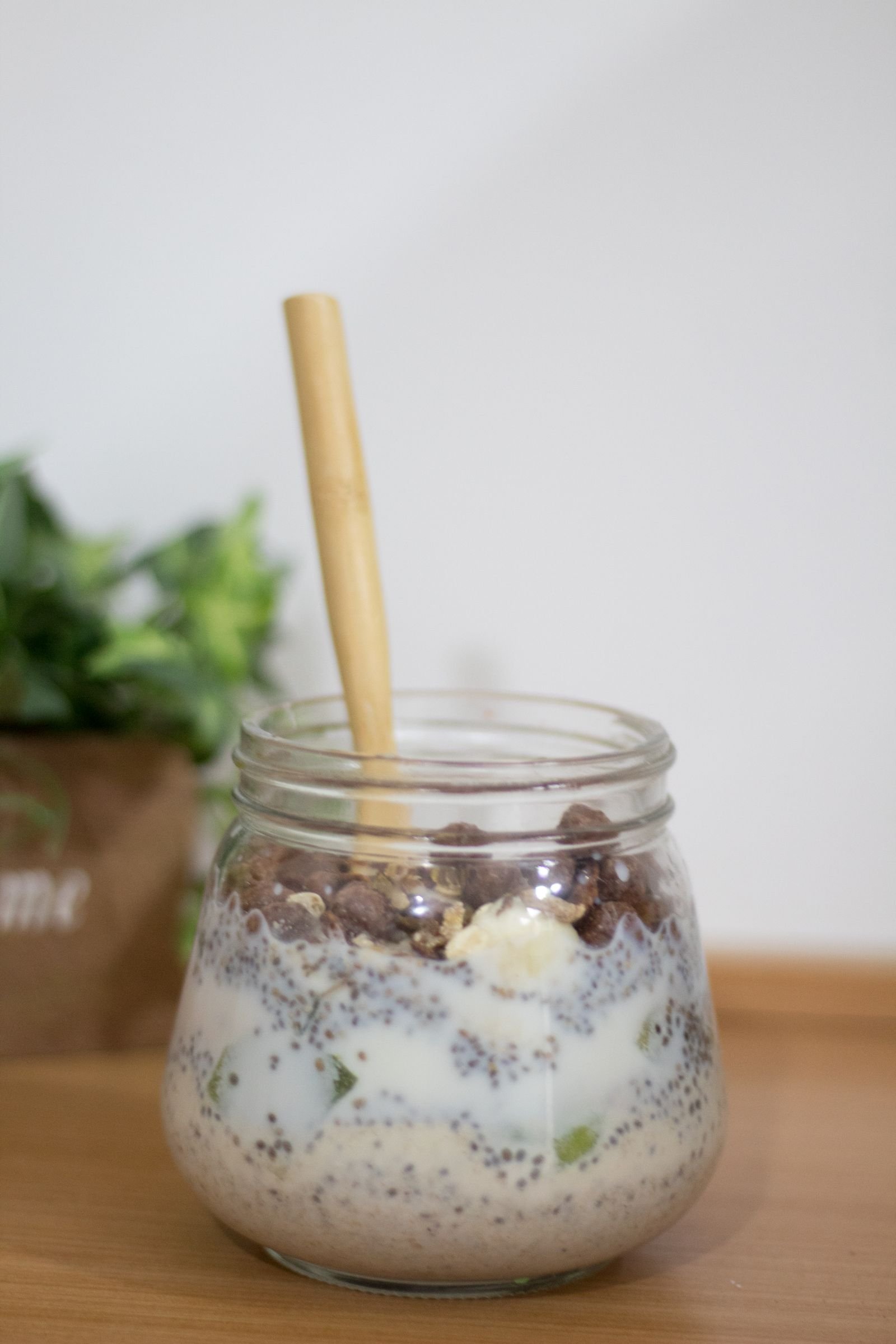 Classic Overnight Oats (Creamy, Make-Ahead, Ready in the Morning) 3 A glass jar of overnight oats with chia seeds and banana pieces topped with chocolate cereal pieces