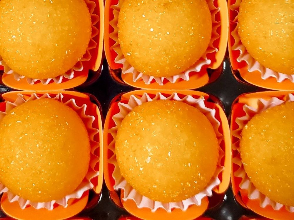 Oreo Pumpkins (The No-Bake 20-Minute Halloween Treat) 4 Close-up of orange Oreo pumpkin truffles in orange cups