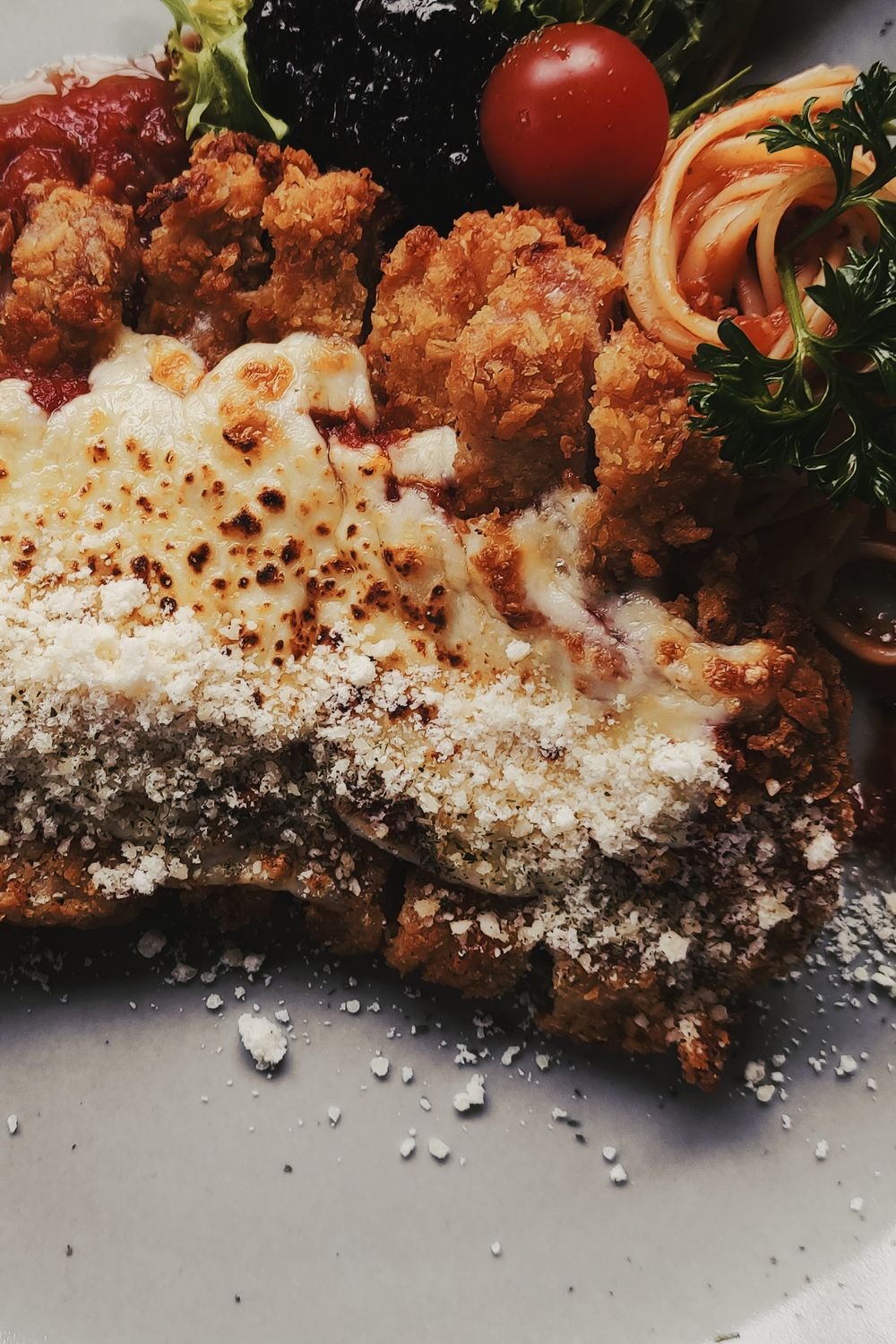 Crockpot Chicken Parmesan: Tender Chicken in Marinara with Melted Cheese 3 Crispy chicken parmigiana with melted cheese, tomato, and spaghetti