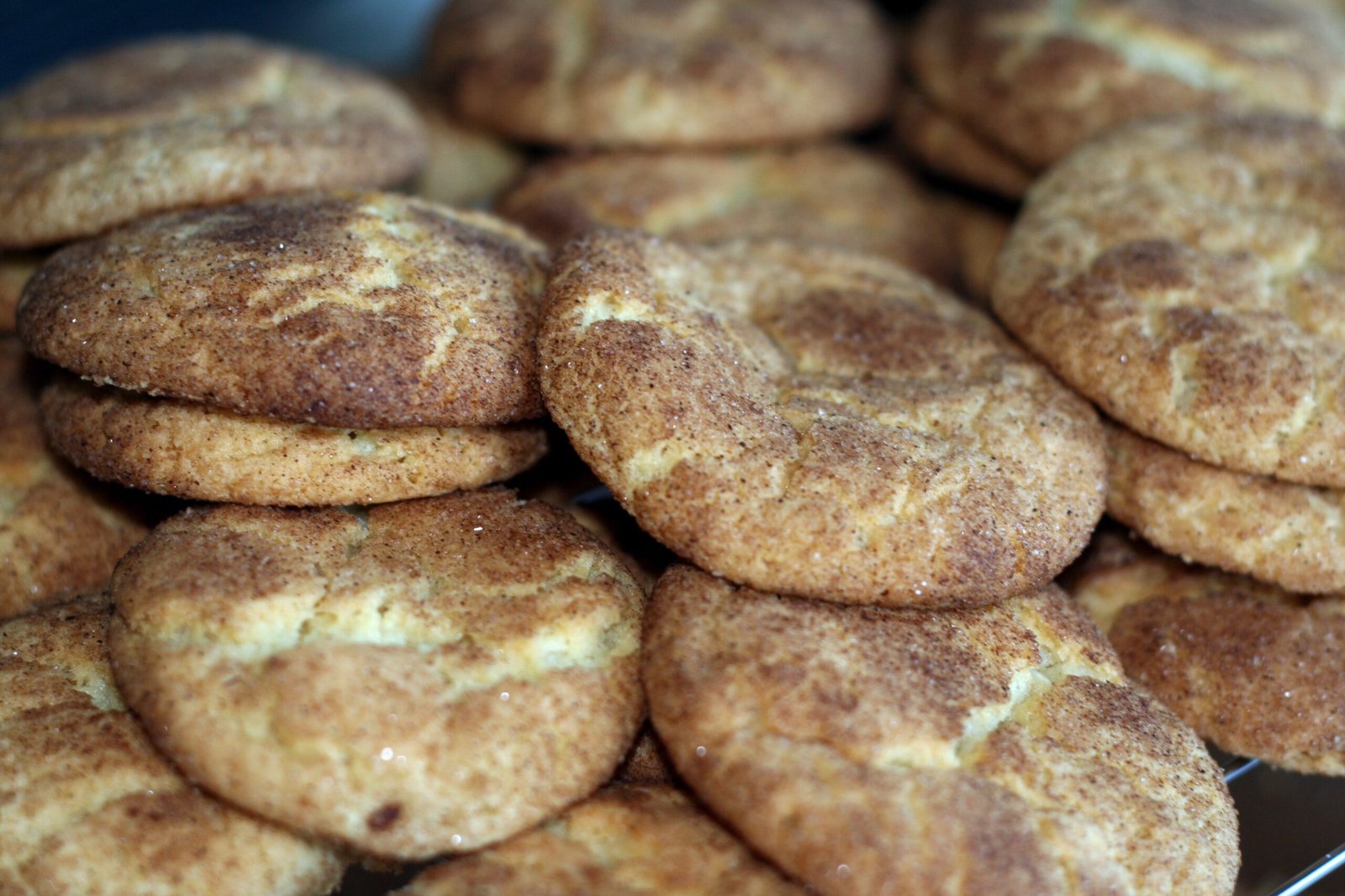 Eggnog Snickerdoodles (Soft, Cinnamon-Sugar, With Real Eggnog) 3 A close pile of cinnamon-sugar-coated snickerdoodle cookies