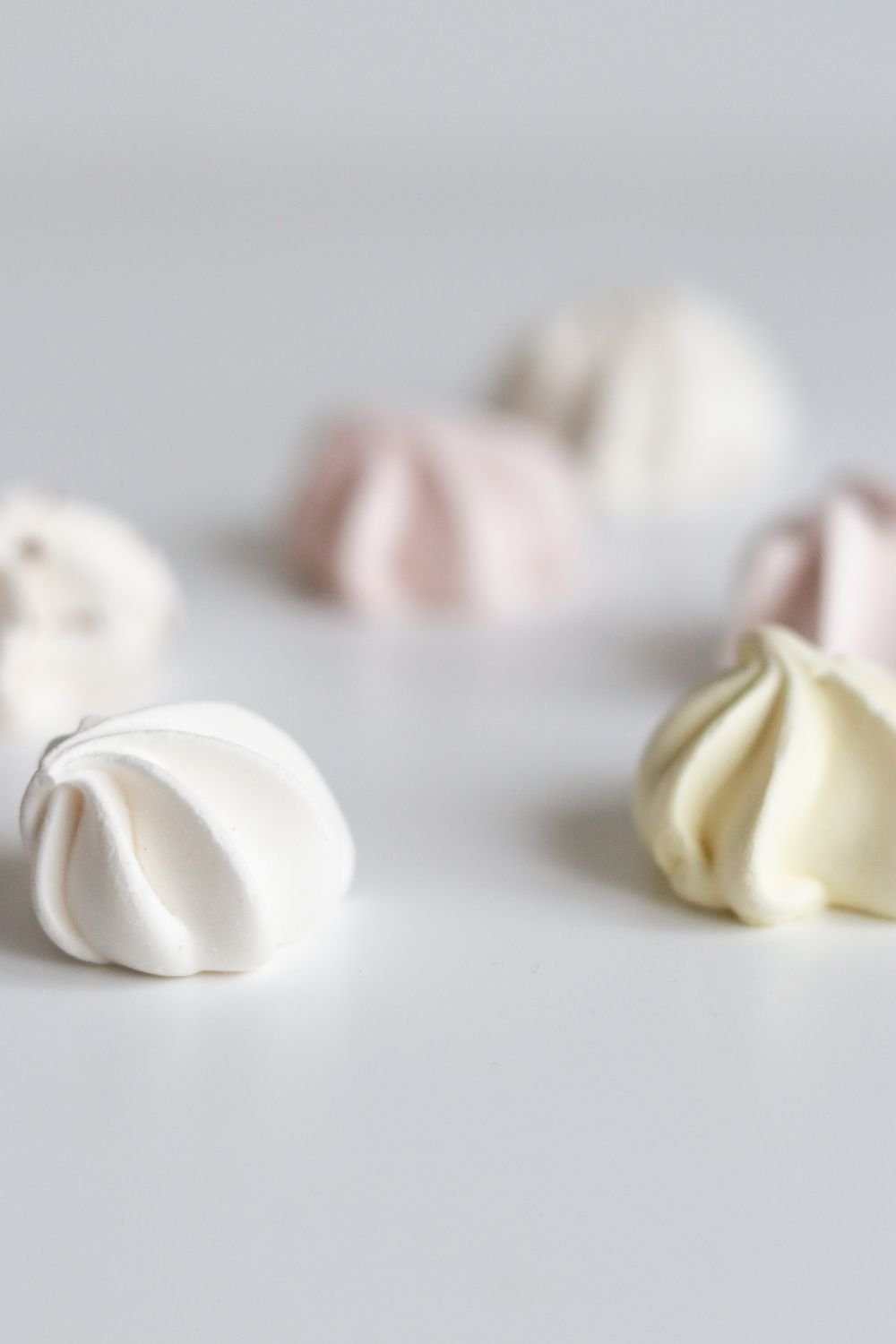 Ghost meringue cookies on a plate