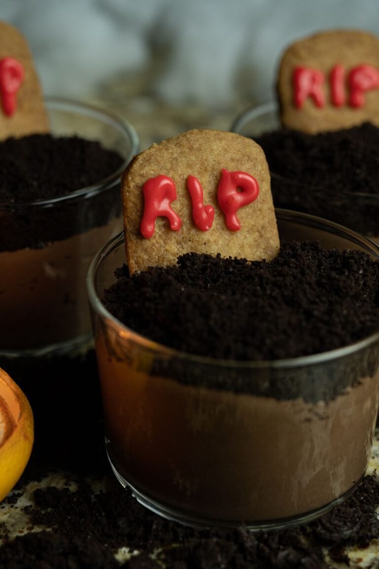 Spooky graveyard dirt cups with RIP cookie tombstones — no-bake Halloween dessert