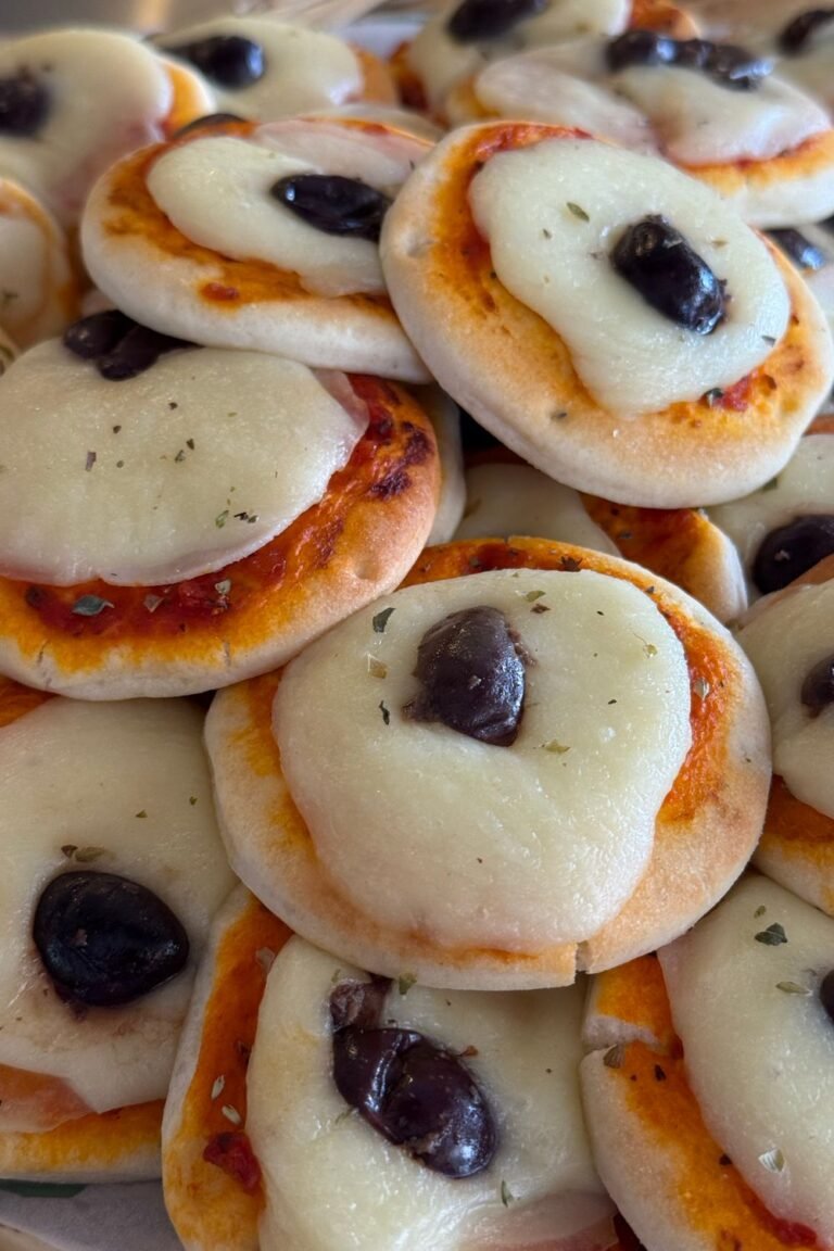 Air Fryer Ghost Mini Pizzas — mini naan pizzas with melting mozzarella ghosts and olive eyes