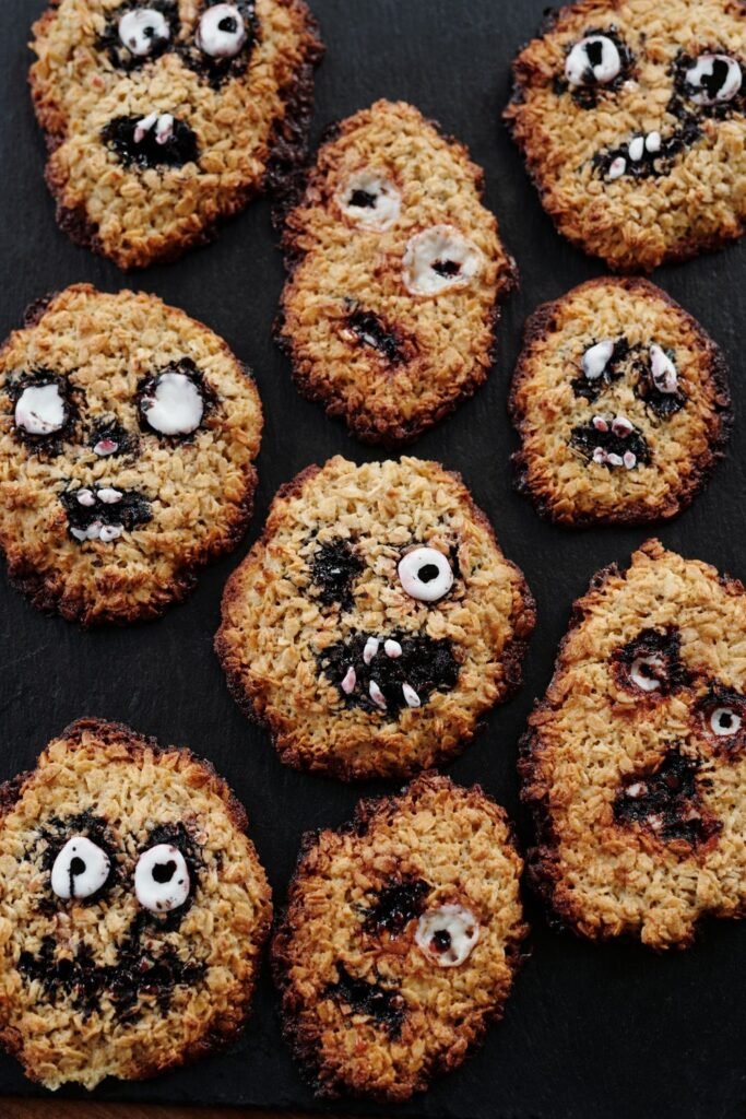 Monster Halloween cookies — chewy oatmeal-chocolate chip cookies with googly candy eyes and chocolate monster mouths