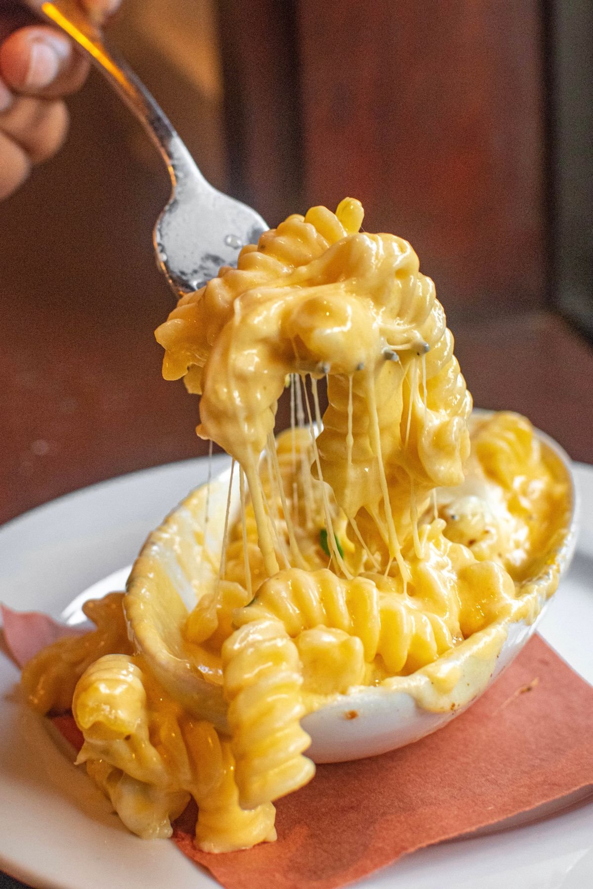 Creamy pumpkin mac and cheese served in a white baking dish