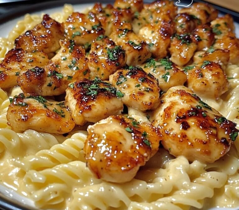 Honey butter garlic chicken bites glazed and served over creamy pasta