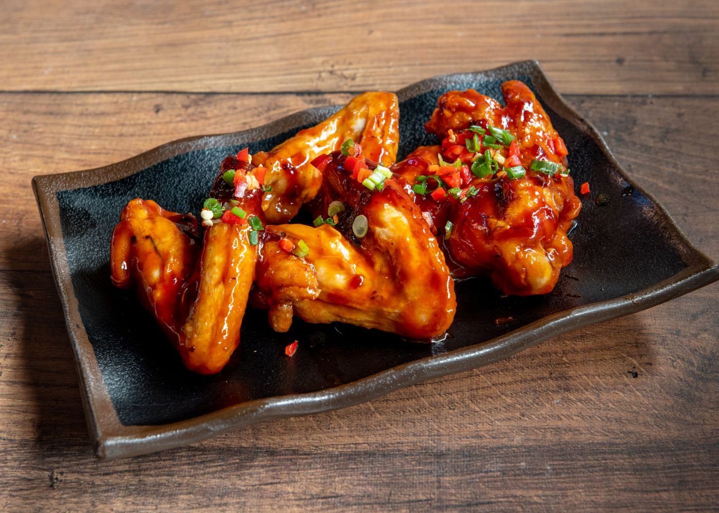 Crispy Air Fryer Bat Wings (The 25-Minute Halloween Party Wings) 3 Crispy glazed chicken wings close up