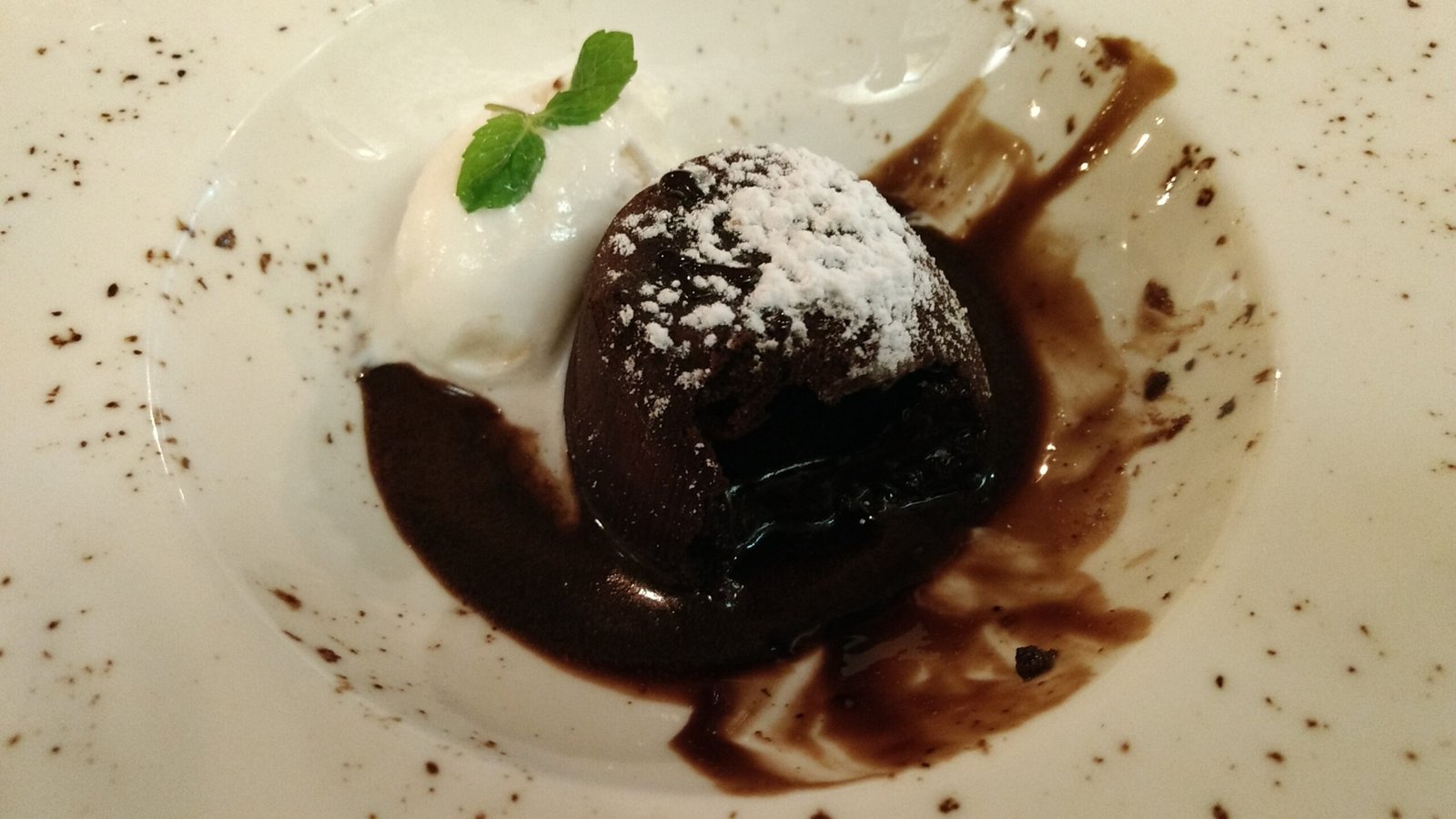 Chocolate lava cake dome with oozing molten center