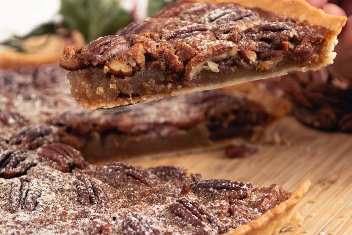 Classic Pecan Pie (The Gooey 75-Minute Thanksgiving Classic) 4 Pecan pie slice being lifted, showing the gooey filling