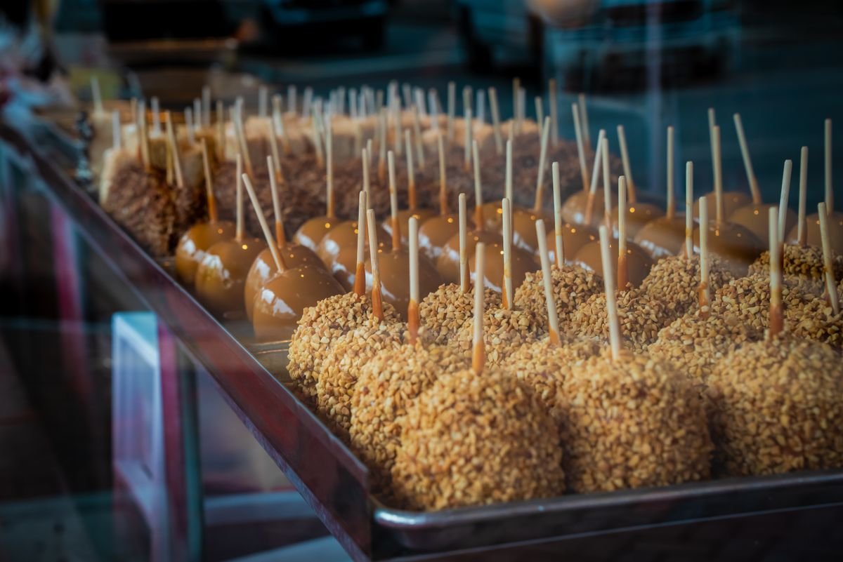 Spooky Caramel Apples (The 30-Minute Halloween Treat) 4 Dipping apples in homemade caramel