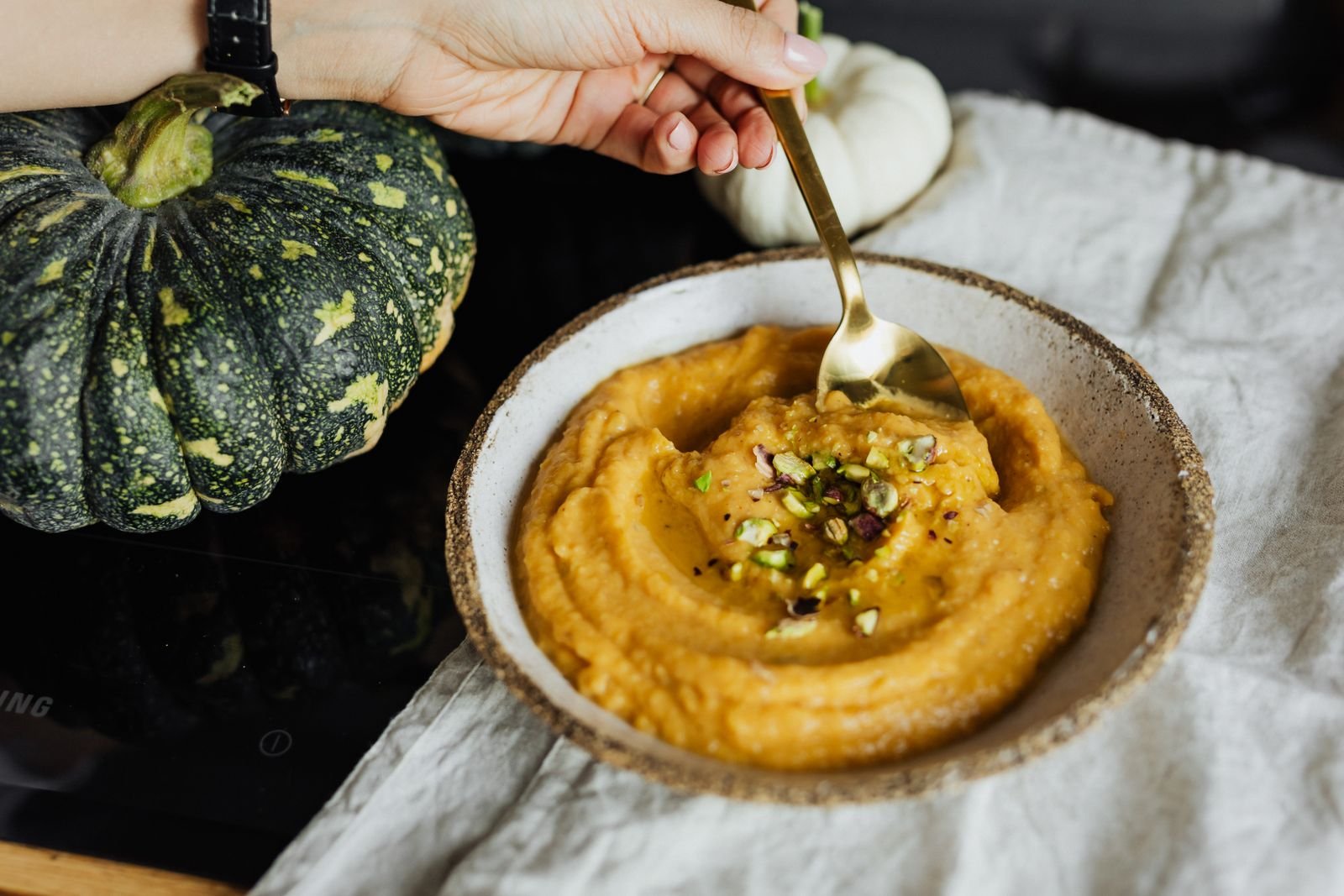 Spooky Pumpkin Hummus (The Creamy 15-Minute Halloween Party Dip) 5 Spooky pumpkin hummus served in a bowl