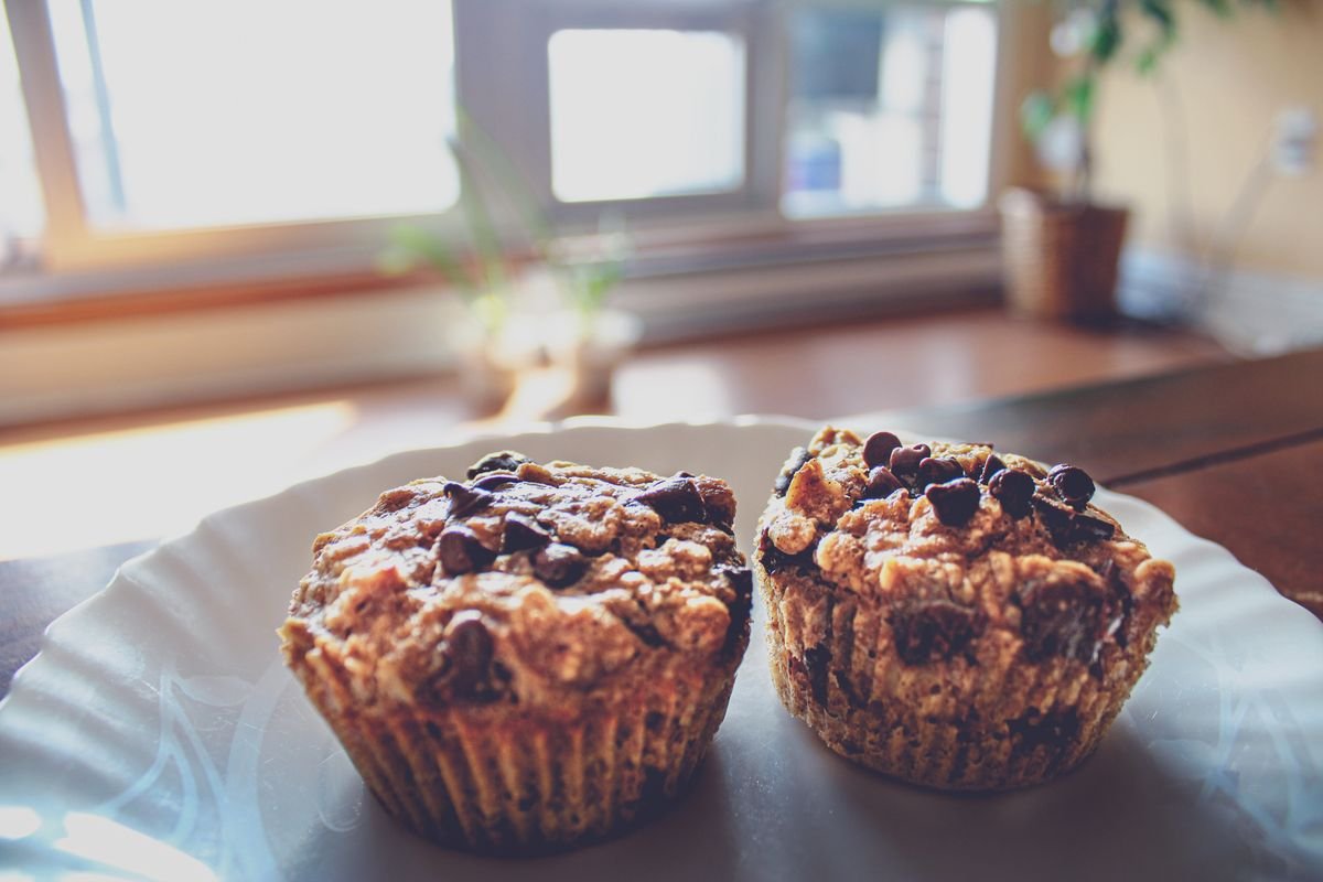 Pumpkin Zucchini Muffins (The Moist 35-Minute Fall Muffins) 5 Two pumpkin zucchini muffins on a plate