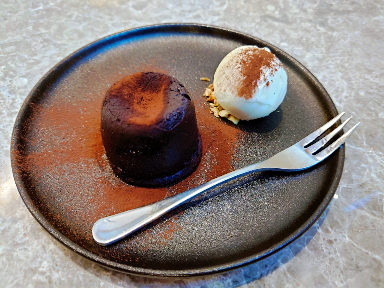 Chocolate lava cake on a dark plate