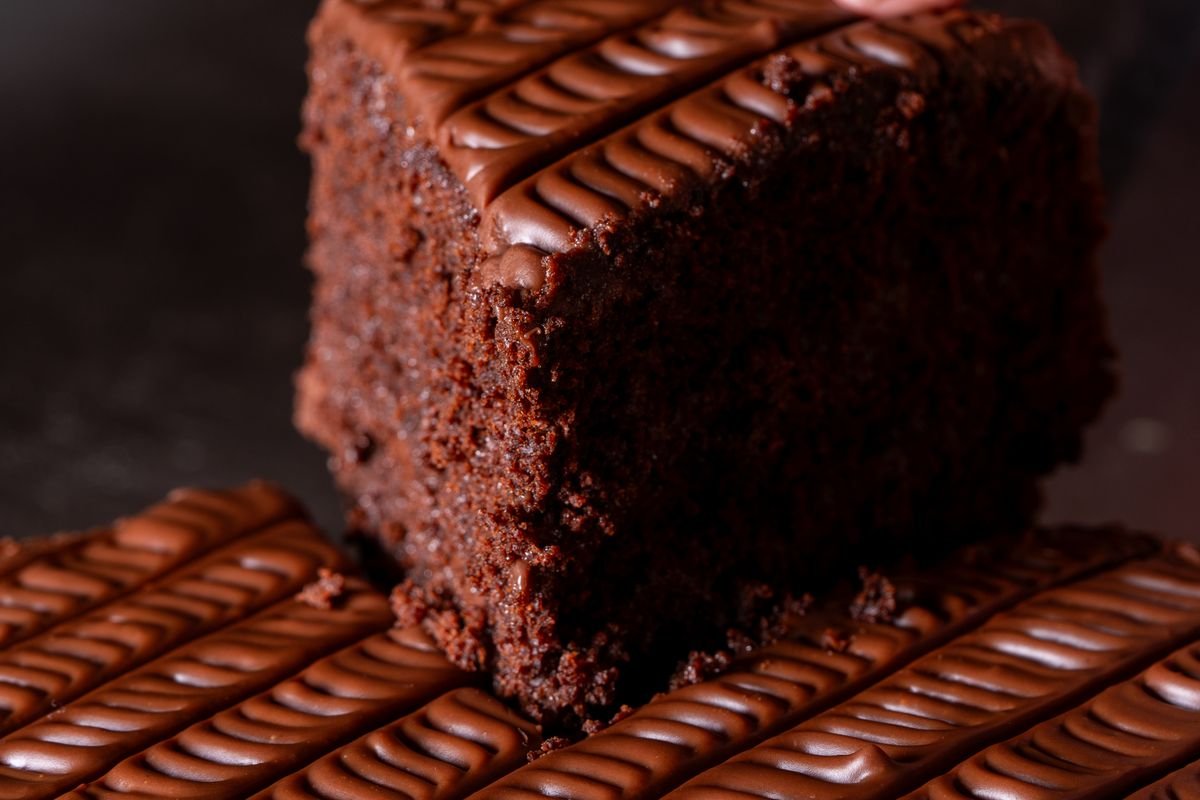 Slice of Spooky Chocolate Dot Cake showing the fudgy crumb