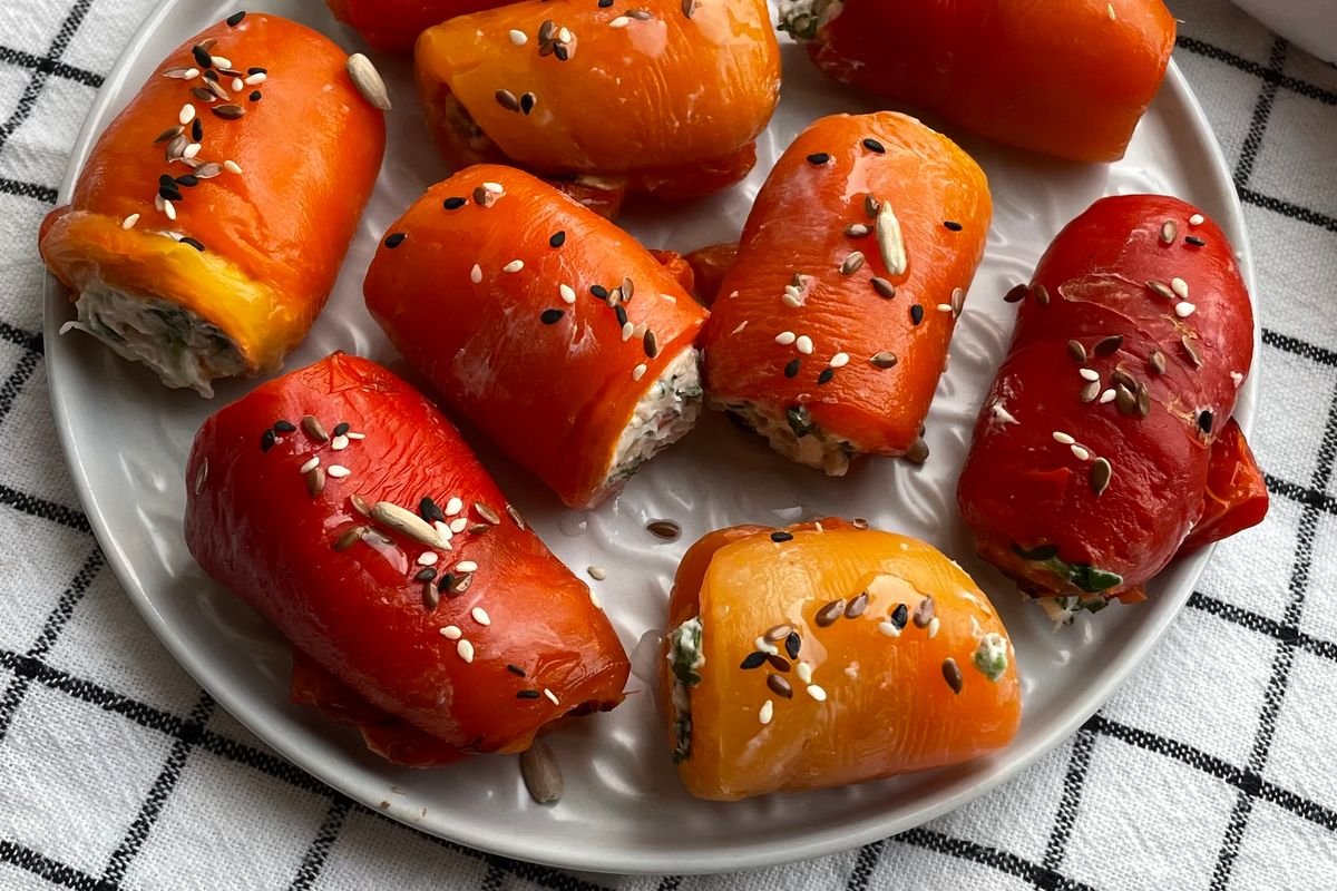 Jack-o'-Lantern Stuffed Peppers (The Spooky 45-Minute Halloween Dinner) 5 Stuffed peppers baking in the oven