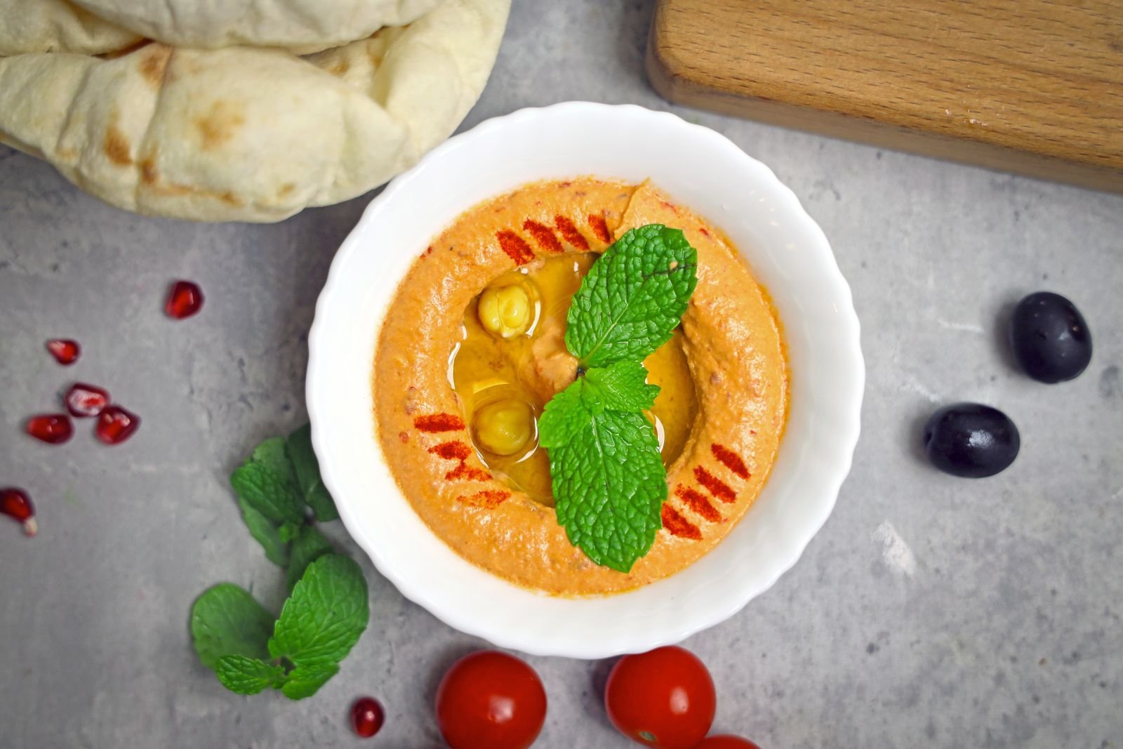 Spooky Pumpkin Hummus (The Creamy 15-Minute Halloween Party Dip) 6 Finished spooky pumpkin hummus with toppings