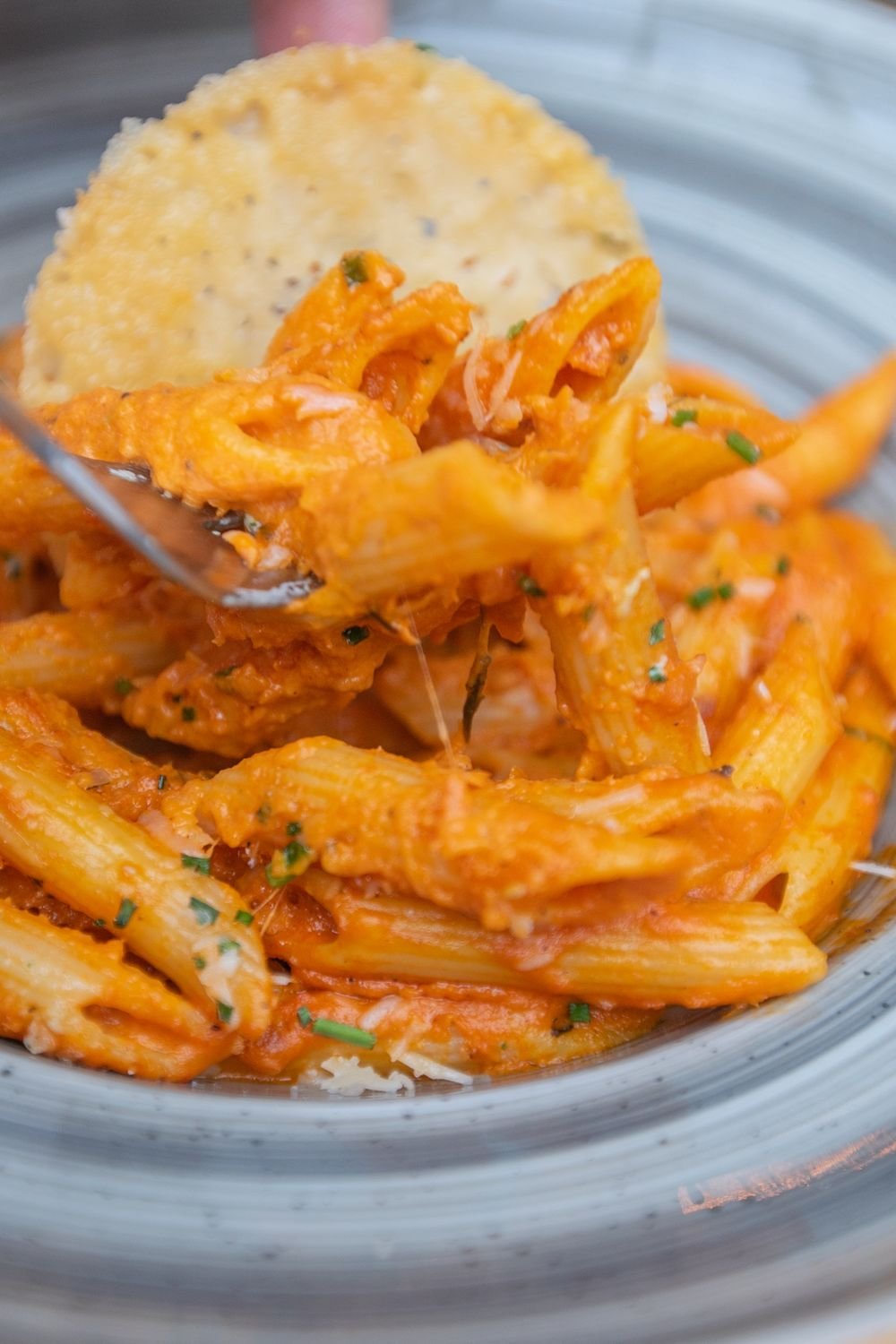 Serving creamy pumpkin burrata baked ziti