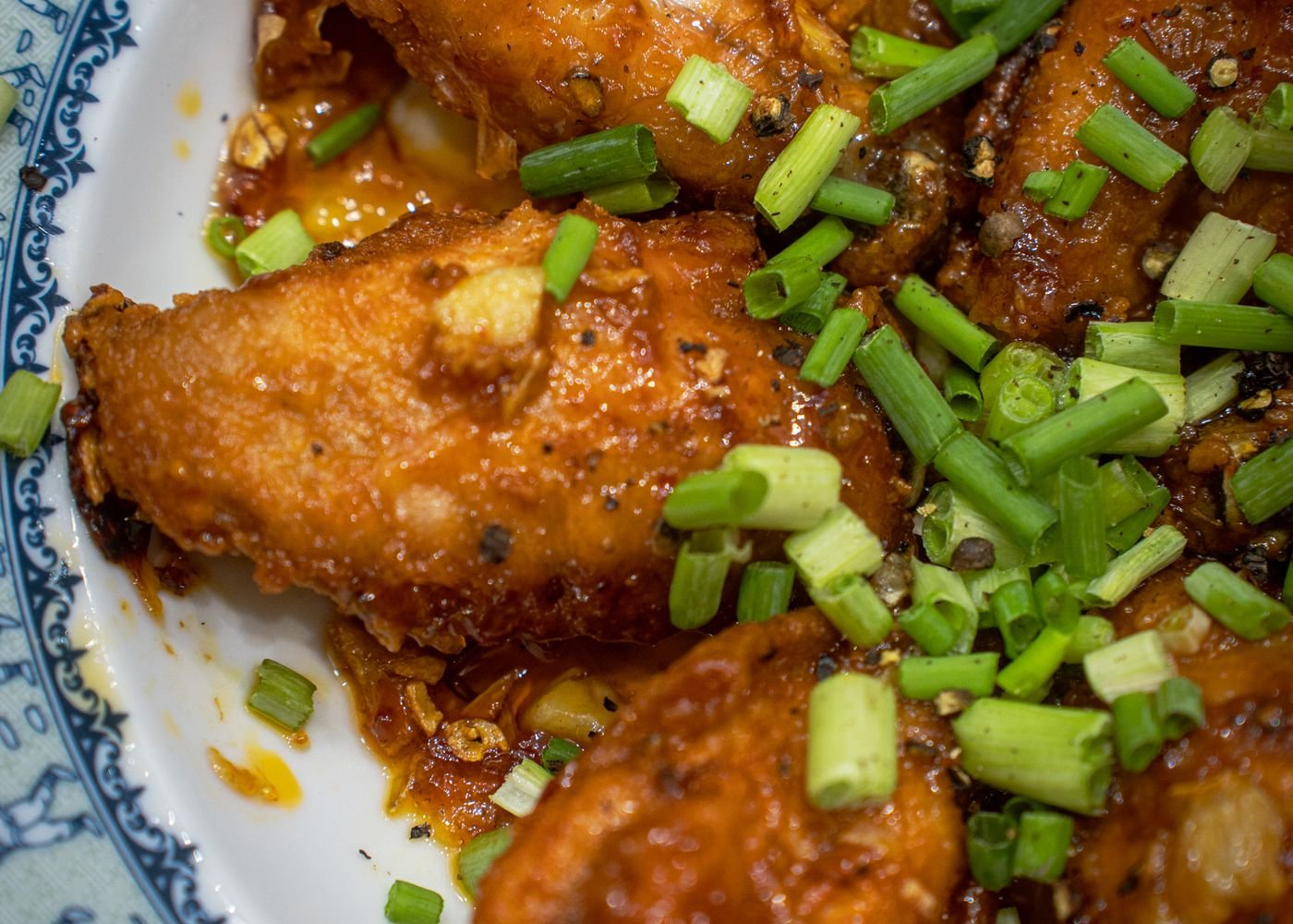 Crispy Air Fryer Bat Wings (The 25-Minute Halloween Party Wings) 6 Finished bat wings with sesame on a platter