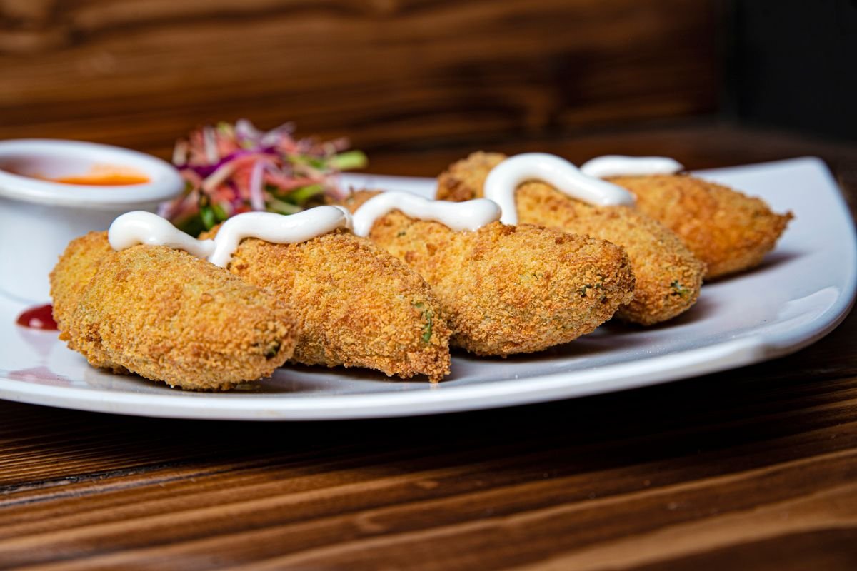 Mummy Jalapeño Poppers (The Spooky 25-Minute Halloween Party Appetizer) 6 Mummy jalapeno poppers with candy eyes