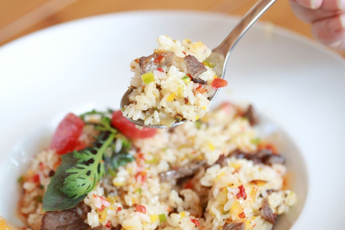 Chicken fried rice cooking in a hot wok