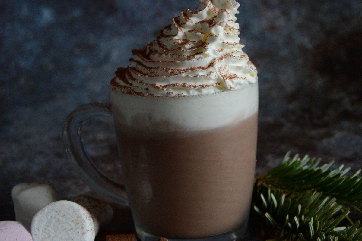 Slow Cooker Pumpkin Hot Chocolate (The Creamy Set-It-and-Forget-It Fall Drink) 3 Mug of pumpkin hot chocolate with whipped cream, marshmallows and chocolate pieces