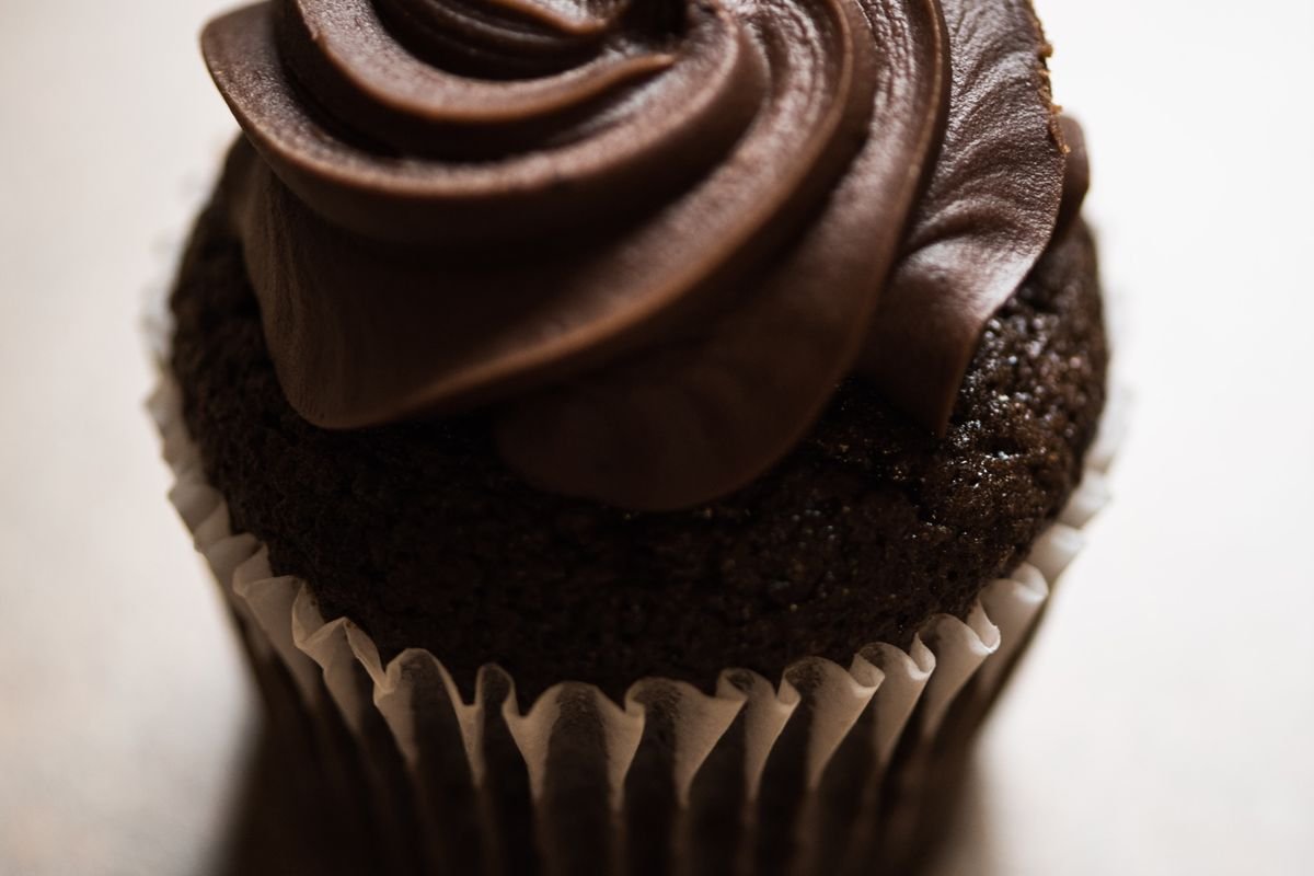 Death by Chocolate Cupcakes (The Ultra-Fudgy 40-Minute Triple-Chocolate Recipe) 3 Close-up of a death by chocolate cupcake with a tall swirl of dark chocolate frosting