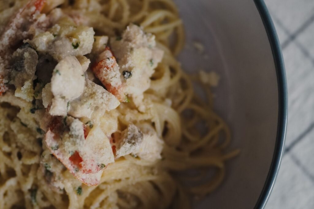 Creamy Marry Me Chicken Pasta (The 30-Minute Weeknight Dinner) 4 Bowl of spaghetti in creamy chicken sauce with tomato and Parmesan