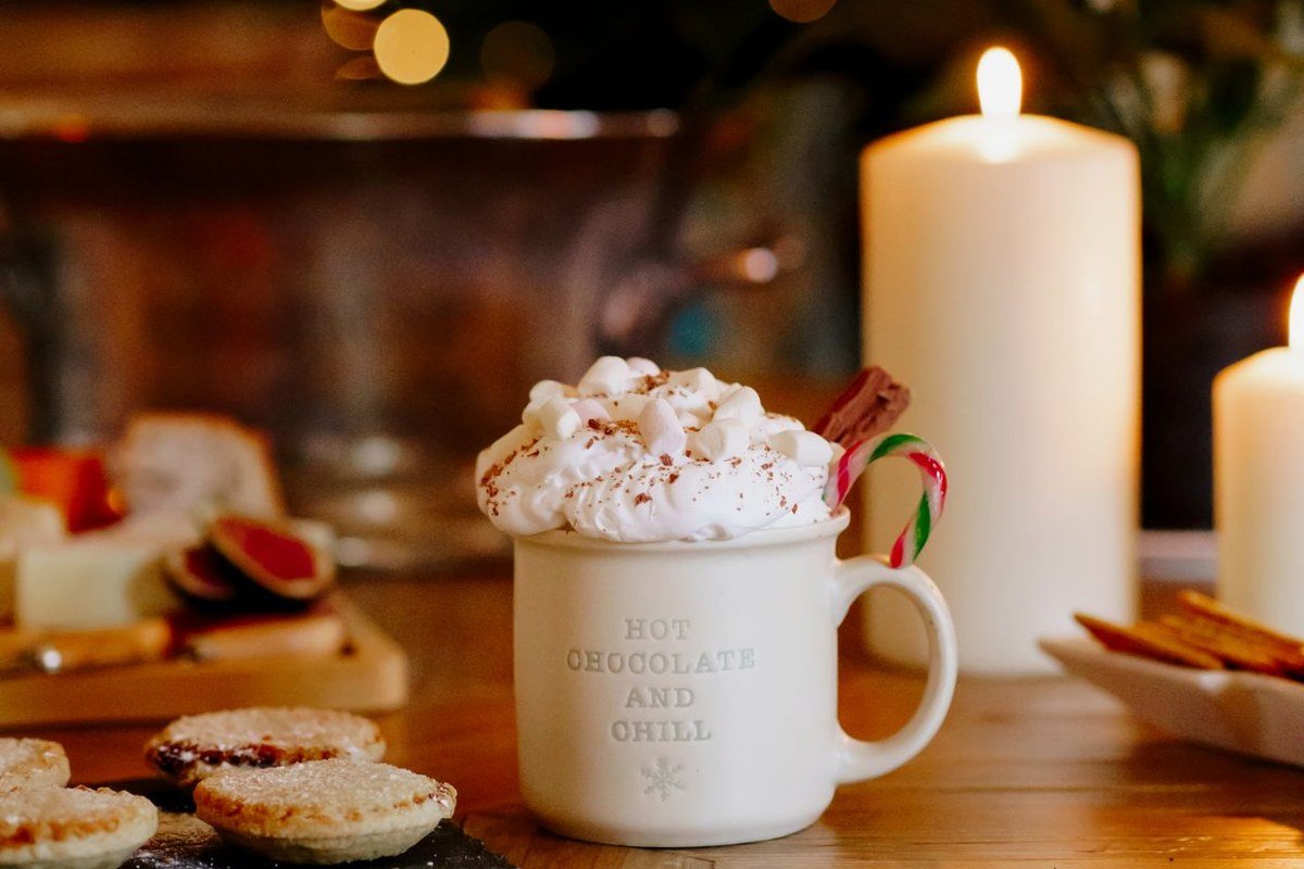 Slow Cooker Pumpkin Hot Chocolate (The Creamy Set-It-and-Forget-It Fall Drink) 5 White mug of hot chocolate with whipped cream and mini marshmallows