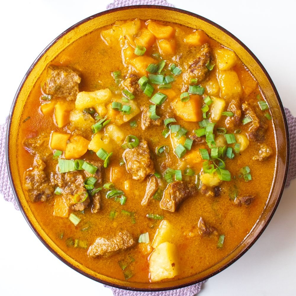 Ghoul-ash (The Spooky 45-Minute Halloween Beef Goulash) 4 Bowl of Ghoul-ash beef goulash with red chilies and potato wedge
