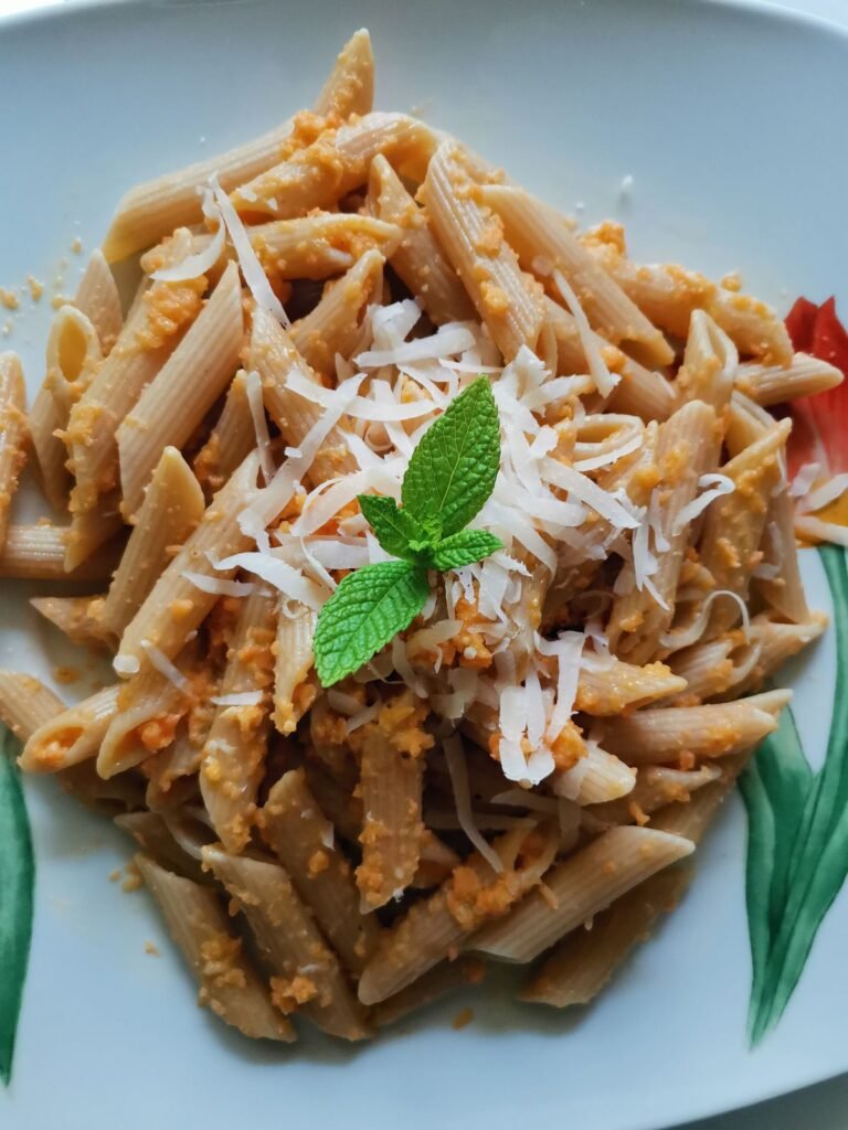 Creamy Pumpkin Pasta (The Cozy 25-Minute Fall Pasta) 3 Orange penne pasta in creamy pumpkin sauce topped with Parmesan
