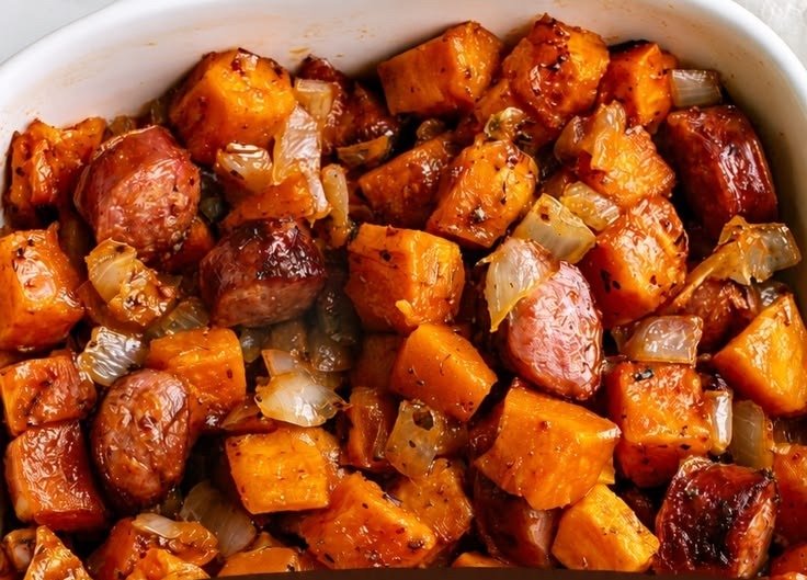 Sheet pan sausage chunks with roasted sweet potato cubes and herbs