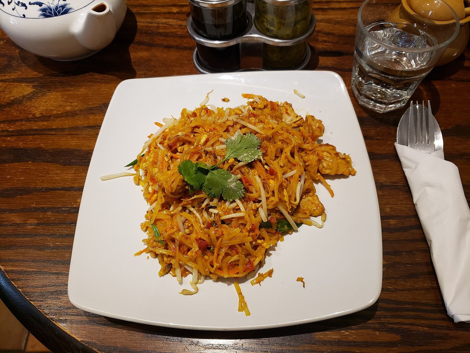 Pad Thai (Better Than Takeout in 30 Minutes) 3 Pad thai noodles with shrimp and cilantro on a white plate