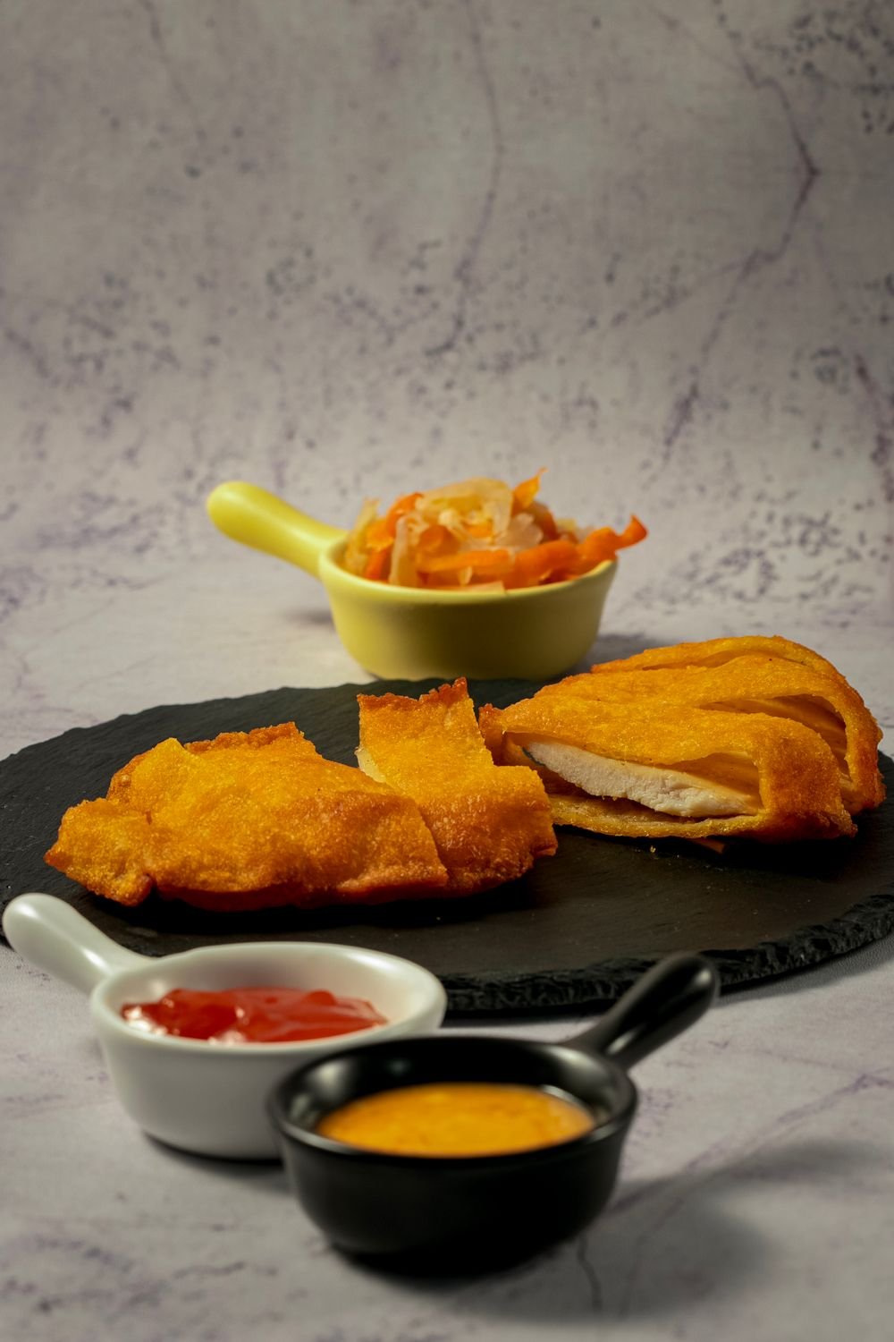 Sliced crispy chicken cutlet showing juicy interior