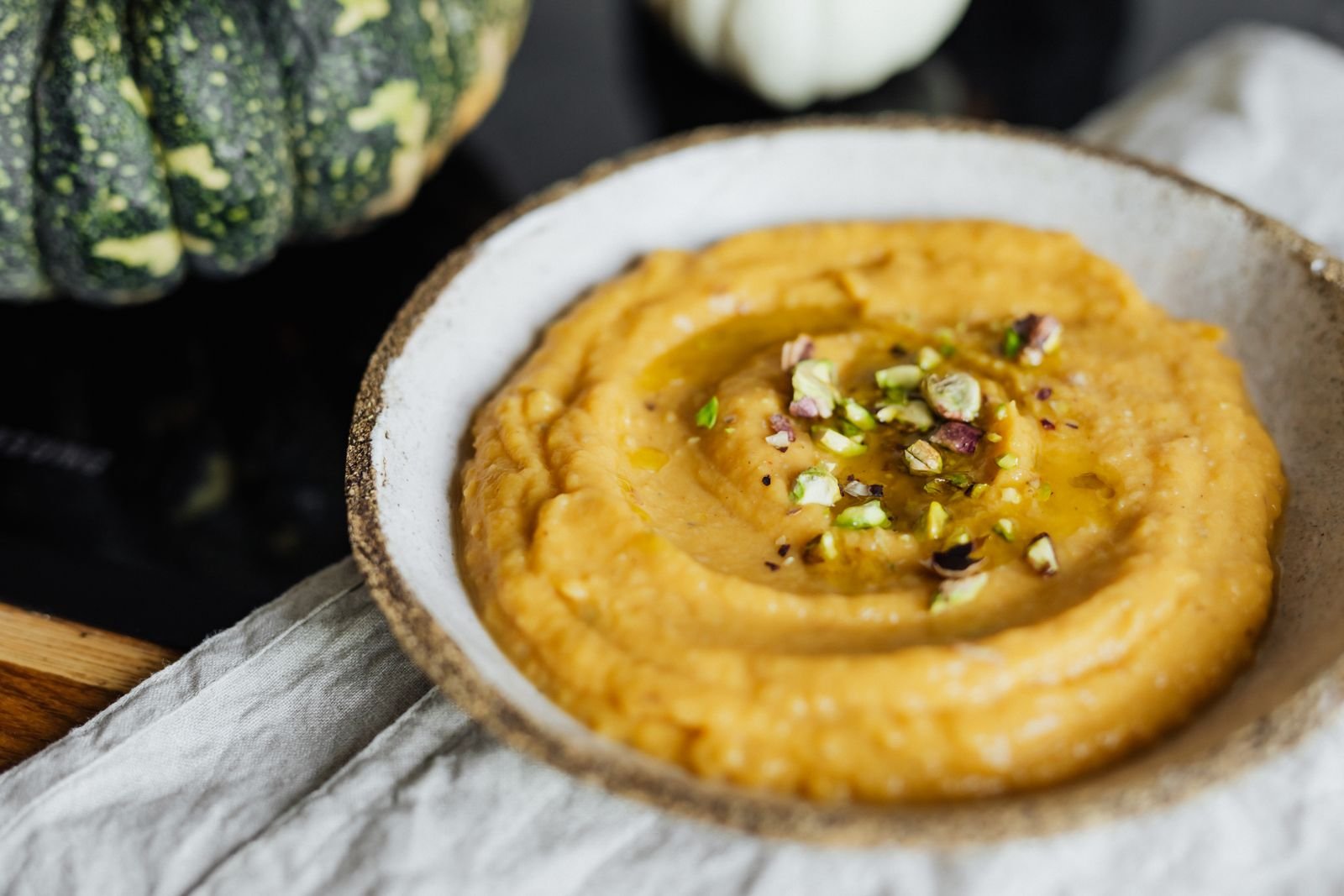 10 Best Pumpkin Recipes You Must Try 7 Creamy orange pumpkin hummus bowl topped with pistachios