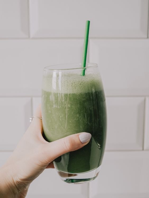 Green monster shake against white tiles