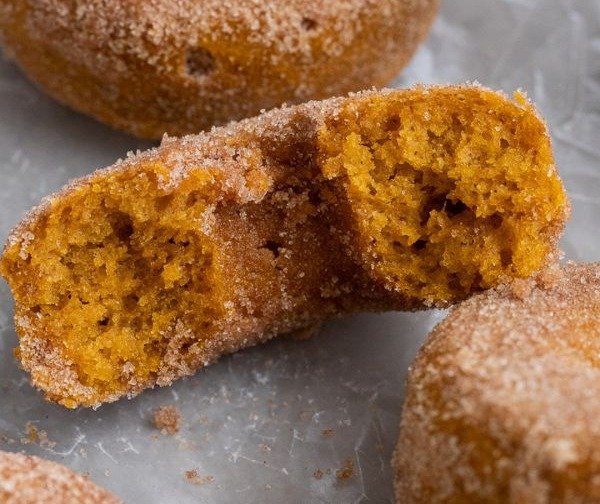 Broken-open pumpkin spice baked donut close-up