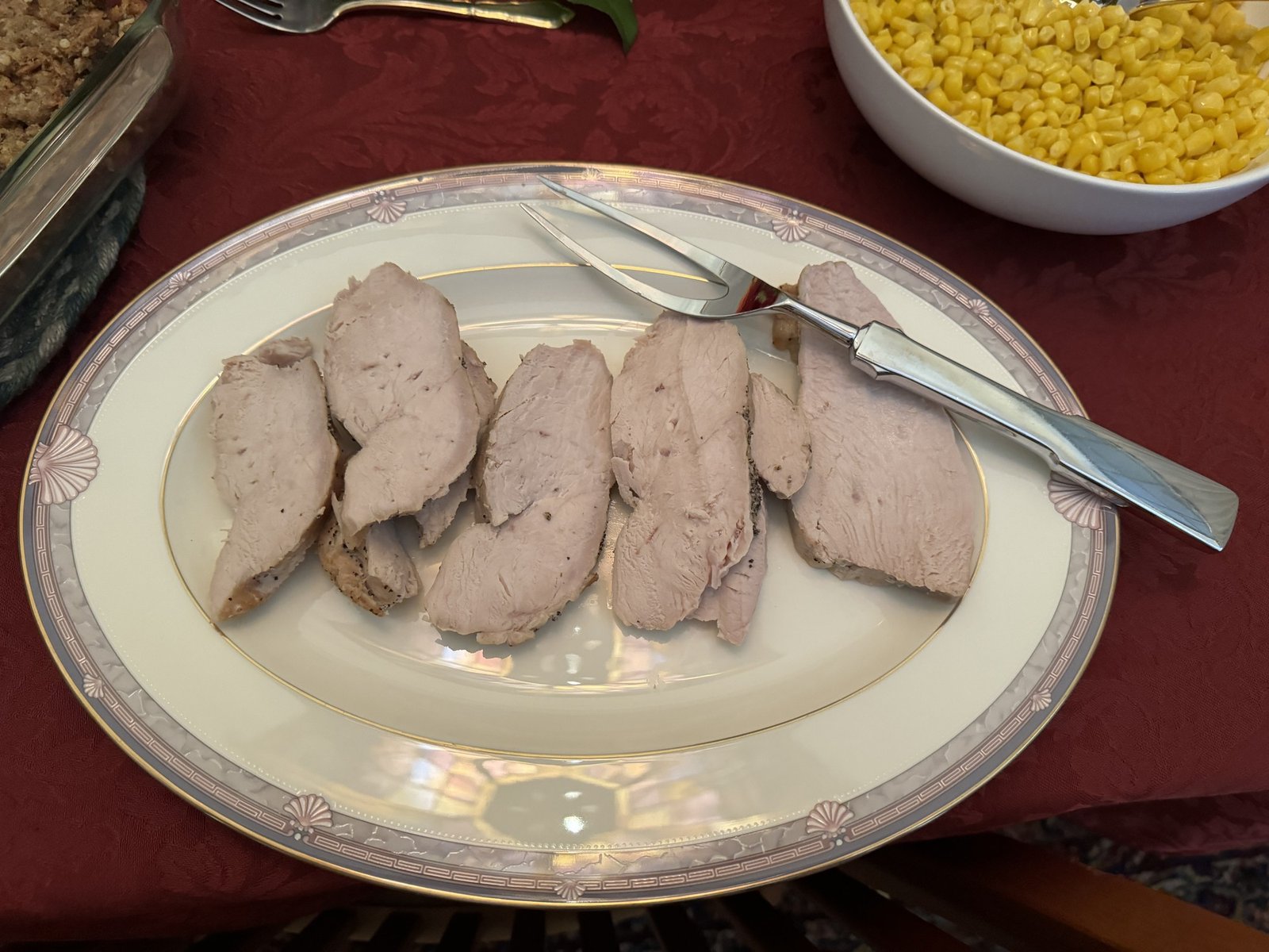 Roast Turkey Breast with Gravy 3 Sliced cooked turkey breast on a platter