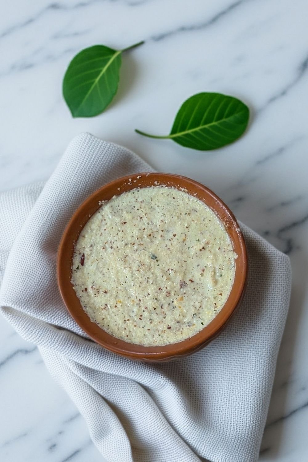 Saffron rice pudding served in an earthenware bowl