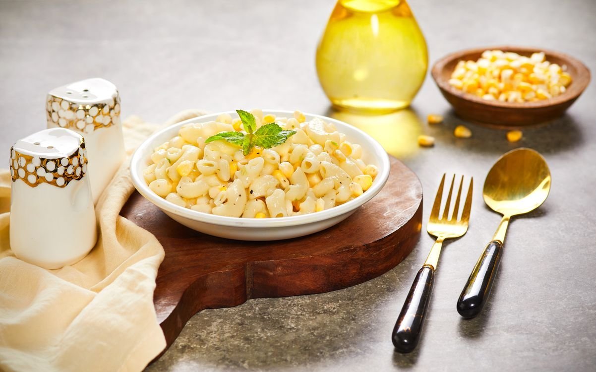 Creamy elote street corn pasta in a white bowl
