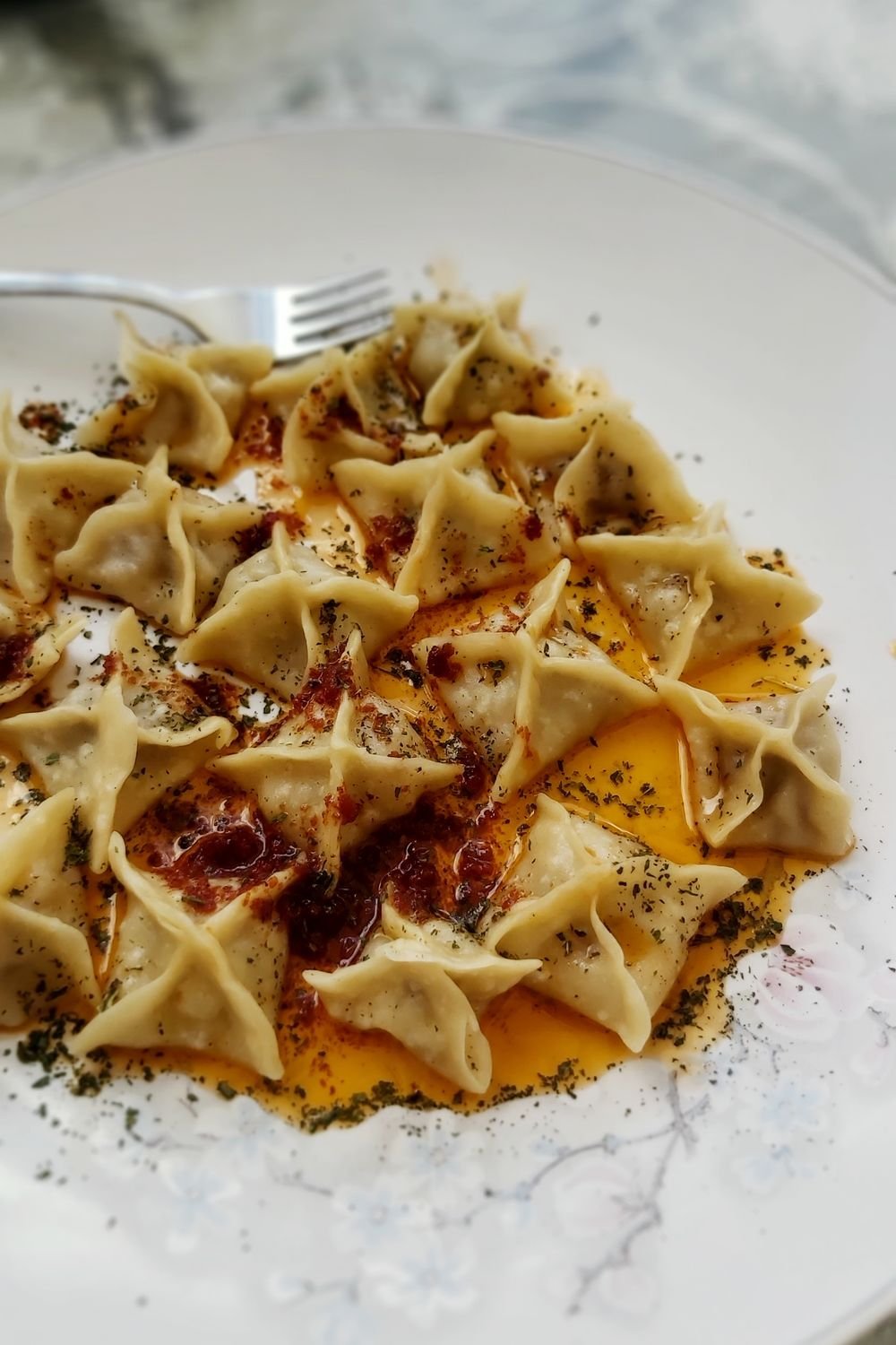 Turkish manti-style dumplings with yogurt and chili oil