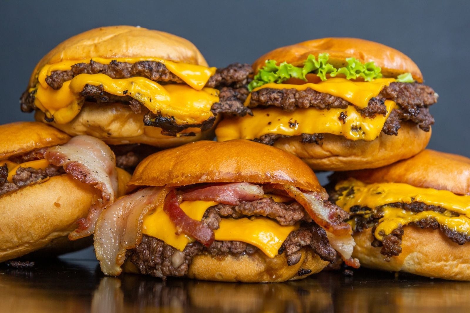 Smash Burgers with Secret Sauce (Crispy-Edged, Ready in 25 Minutes) 3 A pile of double cheeseburgers with melted cheese and lettuce