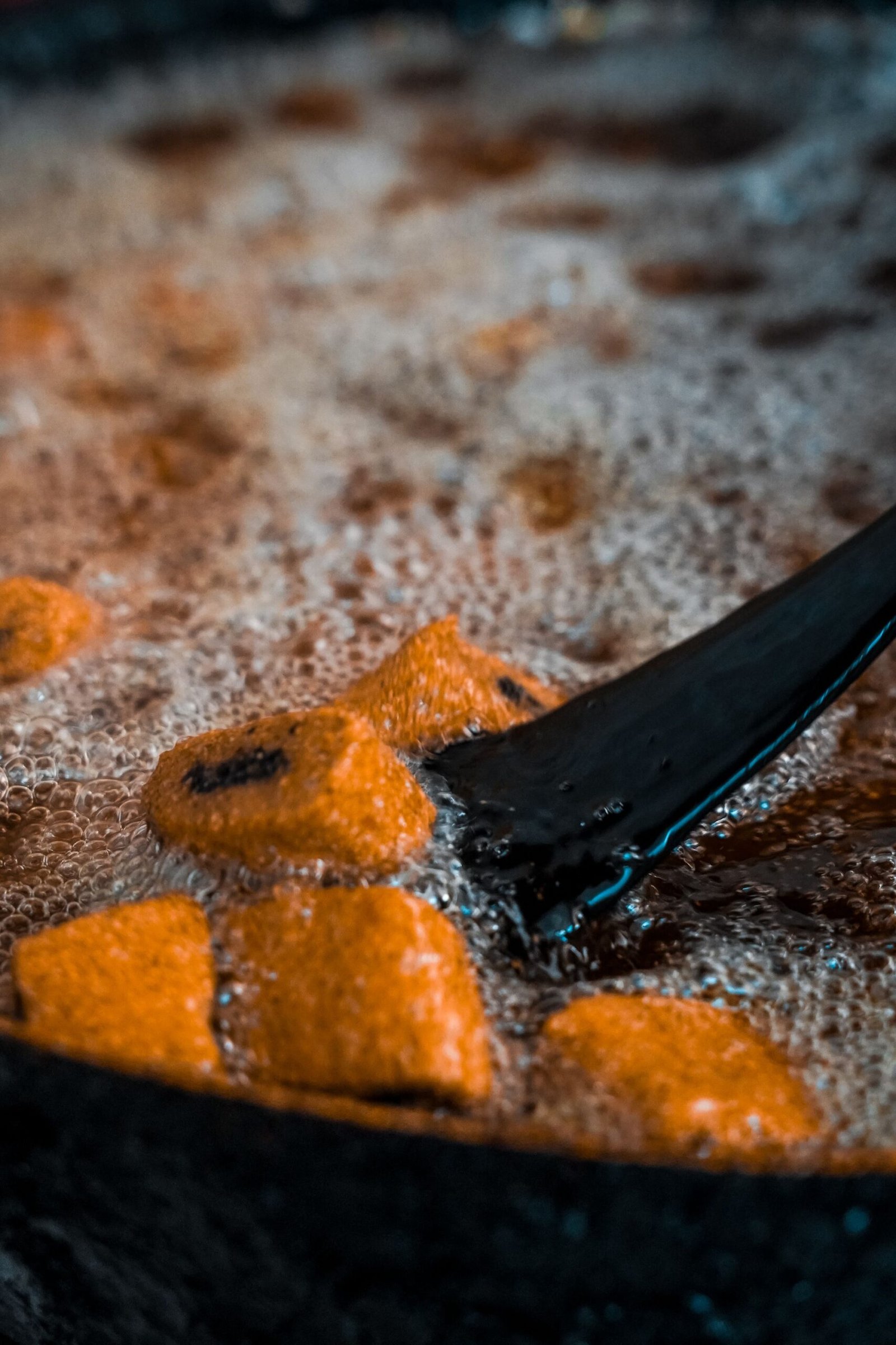 Air Fryer Pumpkin Fritters (The Crispy 25-Minute Halloween Party Snack) 6 Close-up of golden fritters crisping in hot oil