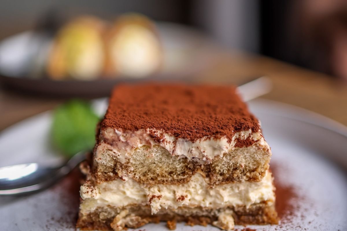 Classic Tiramisu (The Creamy 20-Minute No-Bake Italian Dessert) 1 Classic tiramisu slice with cocoa
